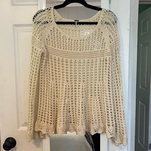 Crochet/knitted free people top in a cream color with flared sleeves